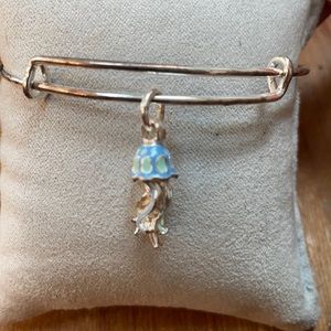 charity by design bracelet. silver, blue and green